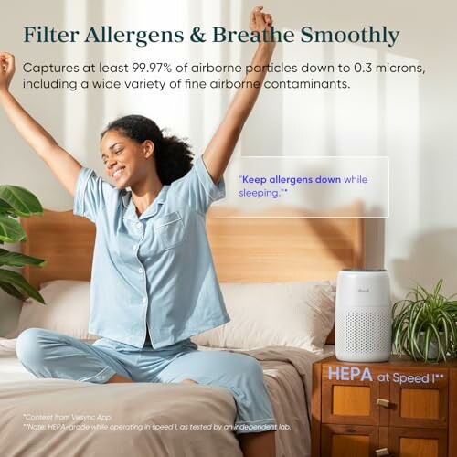 Woman stretching on bed near air purifier, promoting allergen filtration.