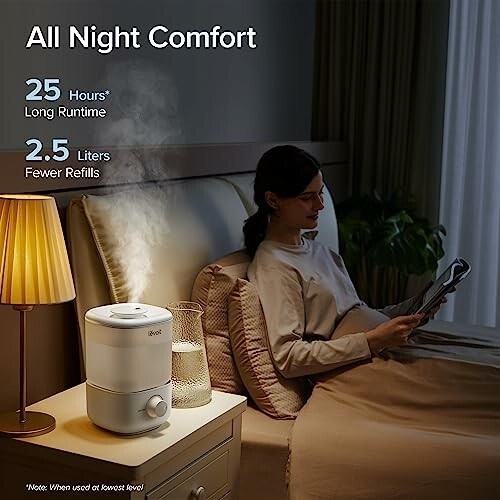 Woman reading in bed with humidifier on nightstand. The Levoit top-fill humidifier is the perfect solution for anyone looking to upgrade their home's air quality. With its easy top-fill design, customizable mist output, and quiet operation, this humidifier is sure to provide optimal comfort and relaxation in your home.