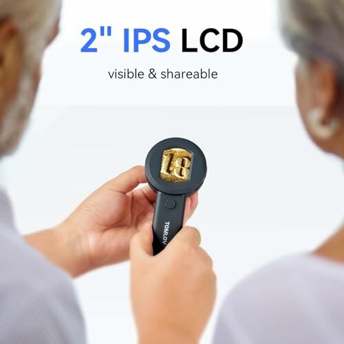 Digital magnifier with 2-inch IPS LCD display held by a person, a great representation of the microscope's usability.