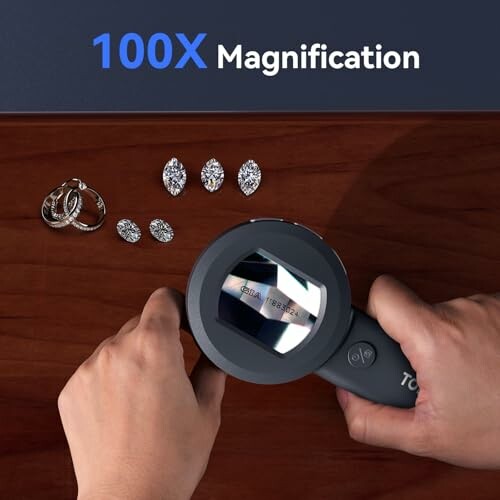 Hands using magnifying glass to view rings and gems on table, showcasing the microscope's usability.