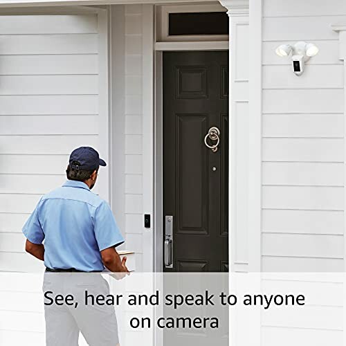 Person approaching door with smart camera and light installed.