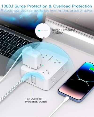 Surge protector with multiple outlets and USB ports, connected to a laptop and phone.
