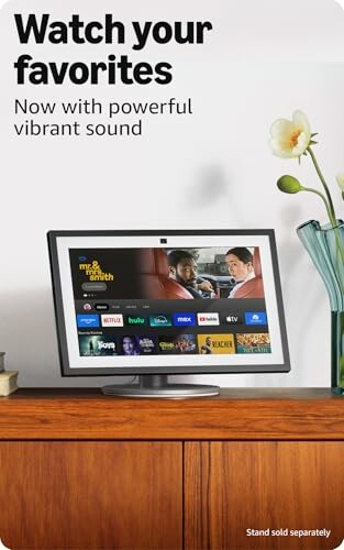 Advertisement showing a monitor with streaming apps on a wooden table, promoting vibrant sound.