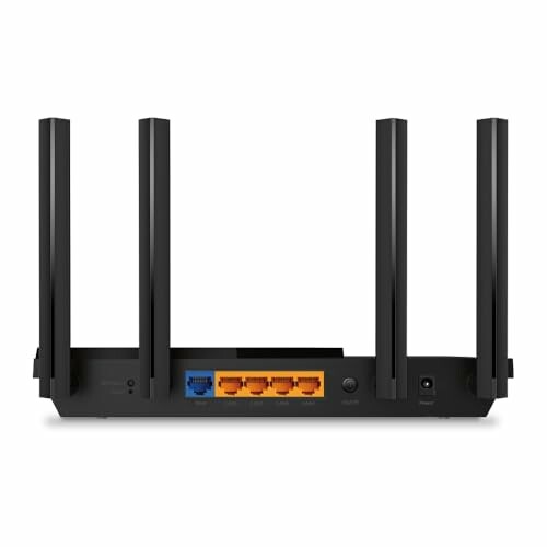 Back view of a wireless router with four antennas and various ports.